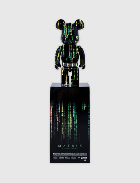 Bearbrick Matrix Resurrections collectible figure with green code design on display box