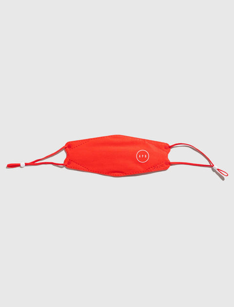 Red face mask with adjustable ear loops and small white circular logo on front