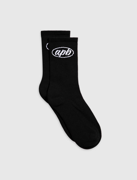 Black crew socks with white embroidered 'apb' logo, streetwear apparel on plain background