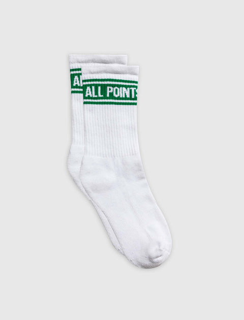White crew socks with green stripes and 'ALL POINTS' text, laid flat on plain background.