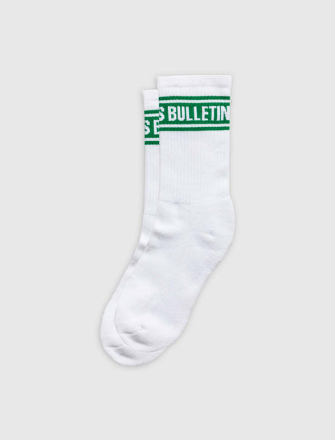 White crew socks with green stripe and BULLETIN text, men's streetwear apparel
