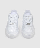 Pair of white low-top sneakers with perforated toe box and white laces, on plain background