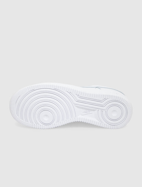 White sneaker outsole with circular traction pattern, viewed from the bottom