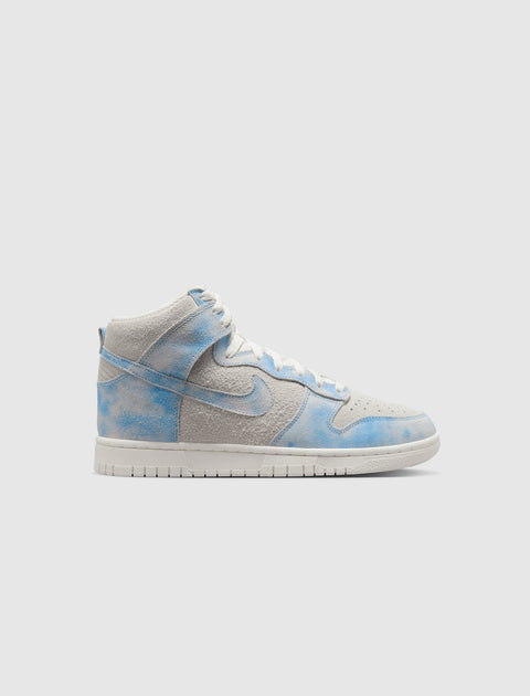 Light grey and blue suede high-top sneaker with cloud pattern on a plain background.