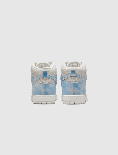 Rear view of blue and white suede high-top sneakers with cloud pattern on a white background.