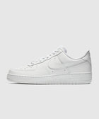 White low-top sneaker with perforated toe and side Swoosh logo on plain background