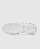 White sneaker outsole with circular grip pattern and textured rubber detailing