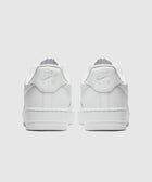 Back view of white low-top sneakers with classic stitching and logo detail on heel