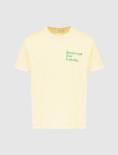 Yellow short sleeve tee with 'Reserved For Locals.' text in green on front chest.