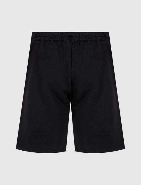 Back view of plain black men's streetwear shorts with elastic waistband